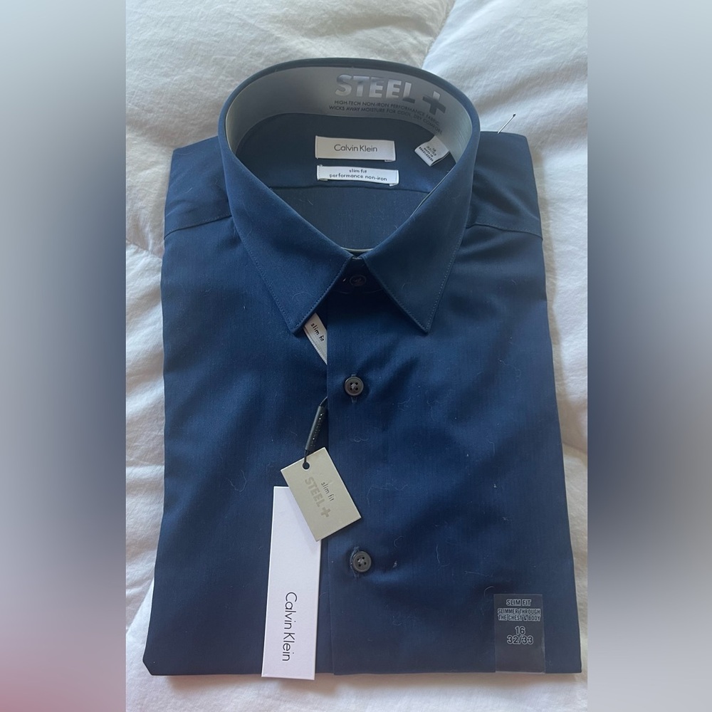 NWT - Mens blue Calvin Klein button down shirt. 16” x 32/33”.slim fit.